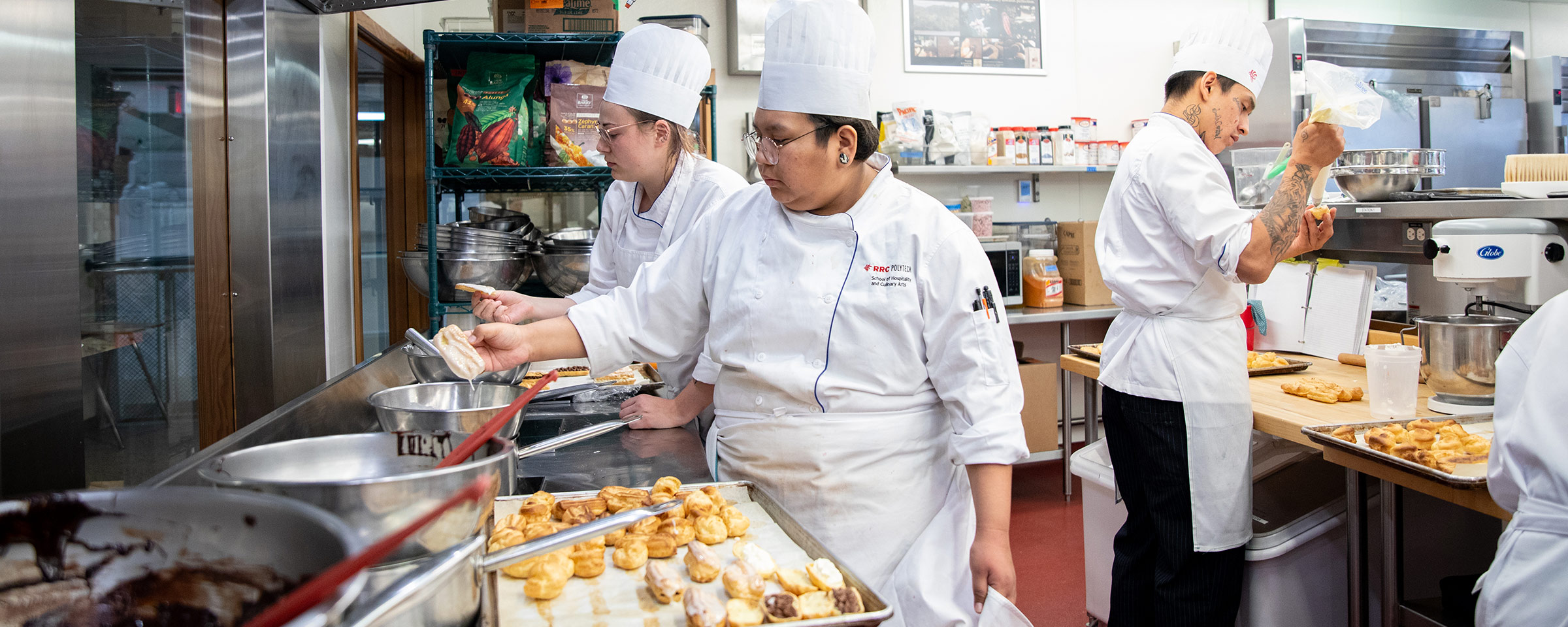 Culinary students cooking in a commercial kitchen