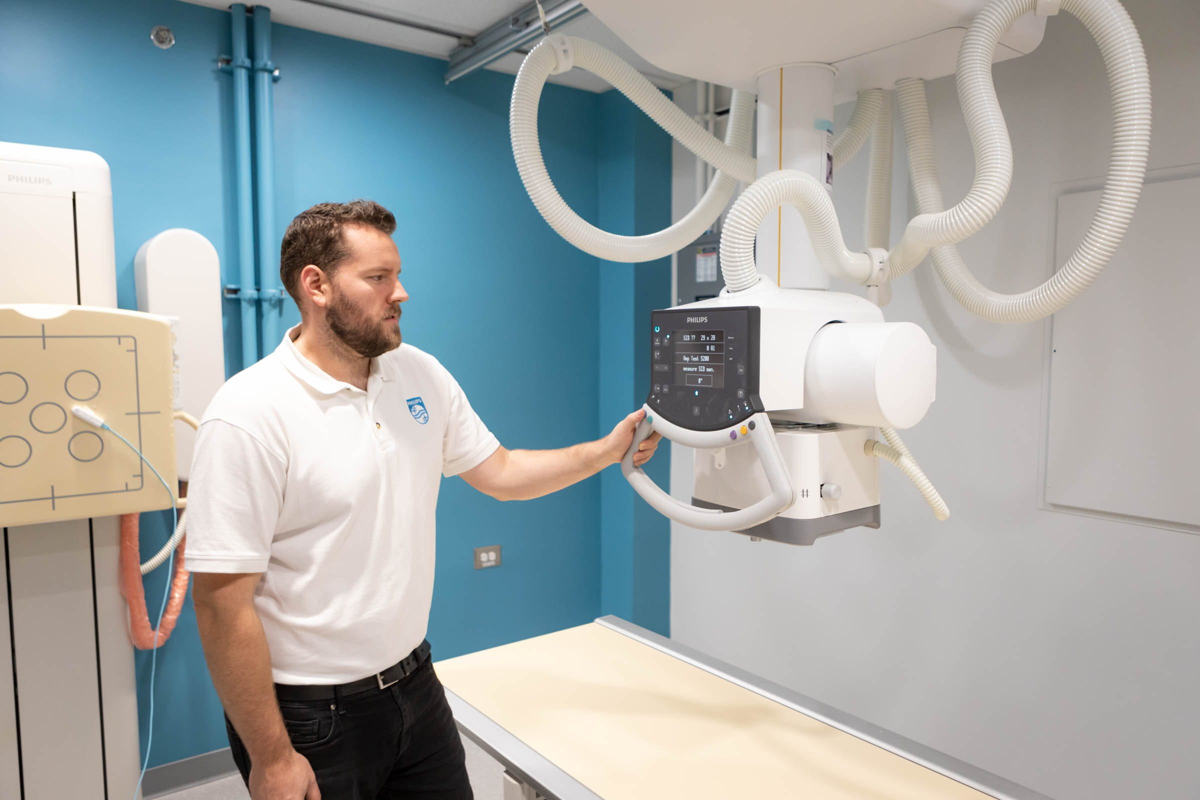 John Hamilton with X-ray equipment, Red River College Polytechnic