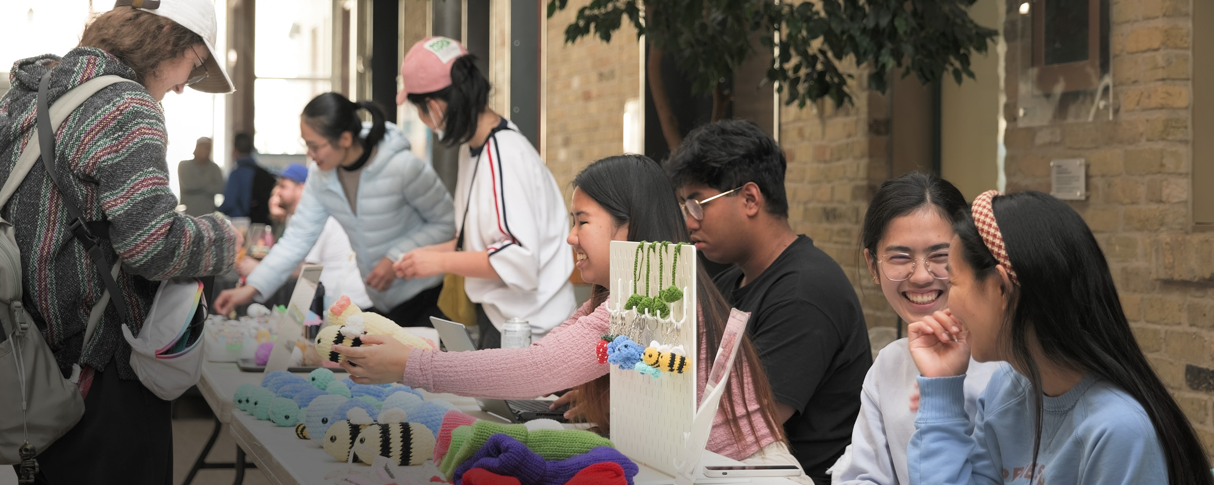 Students selling handmade goods at a market