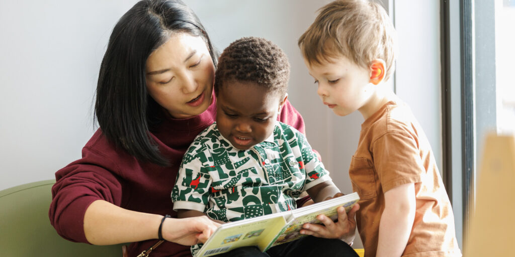 Early childhood educator reading to a child