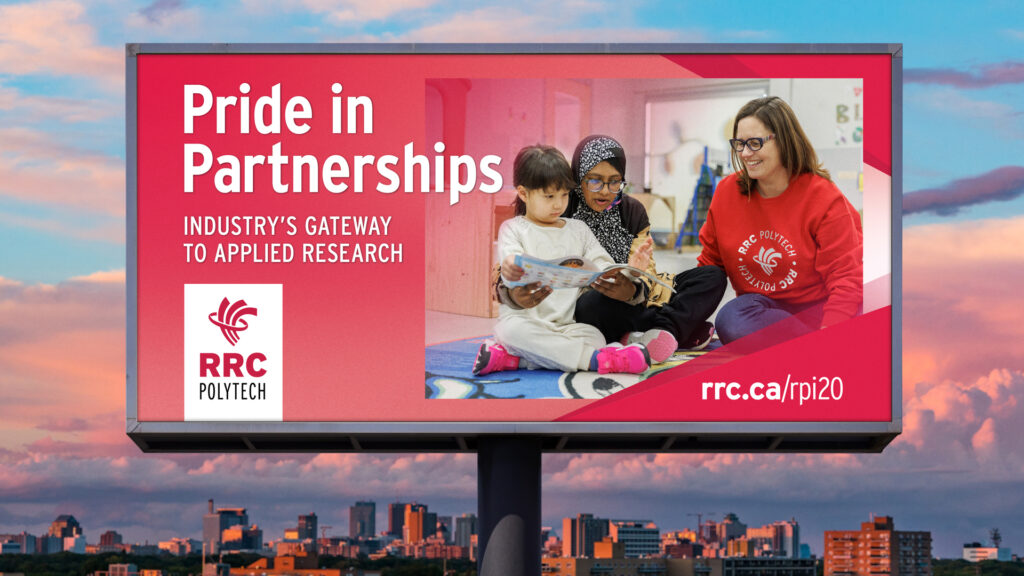a billboard promoting RRC Polytech's Pride in Partnerships featuring 2 educators reading to a child