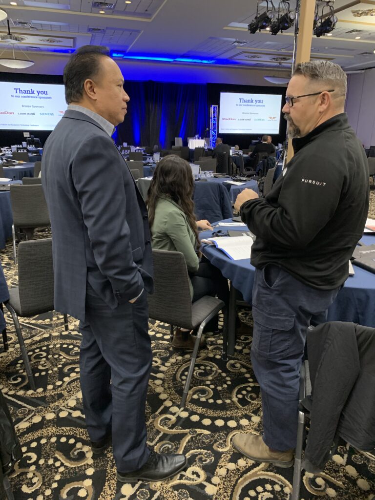 2 people chatting during conference break