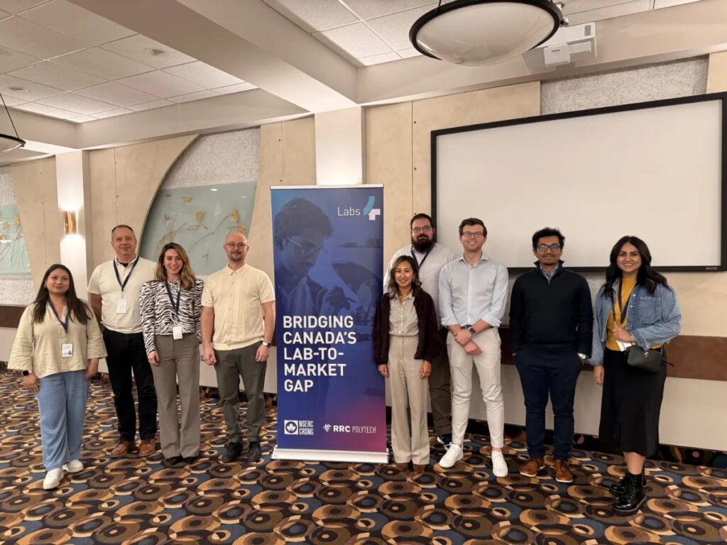 Labs4 program managers standing with banner