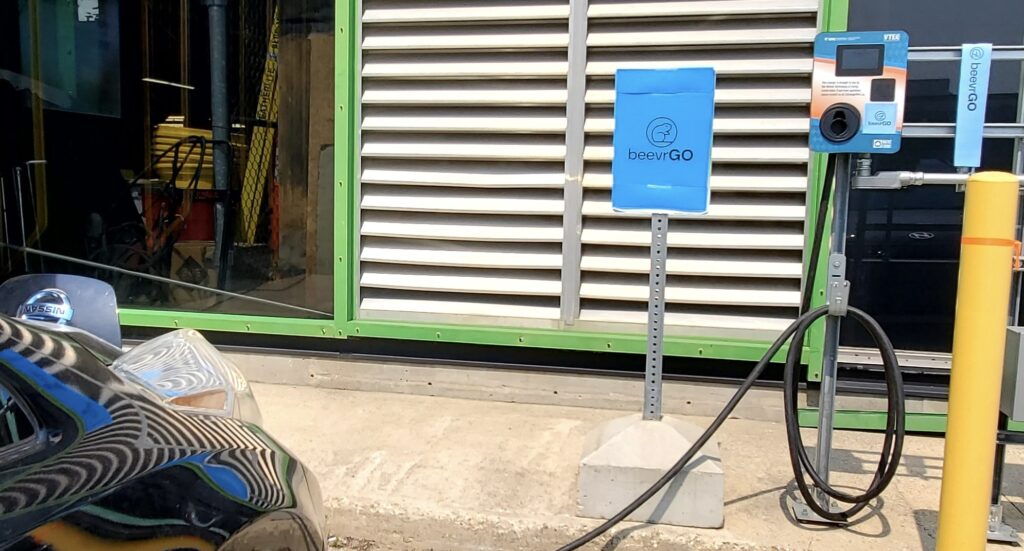 electric vehicle charging station with beevrGO signage
