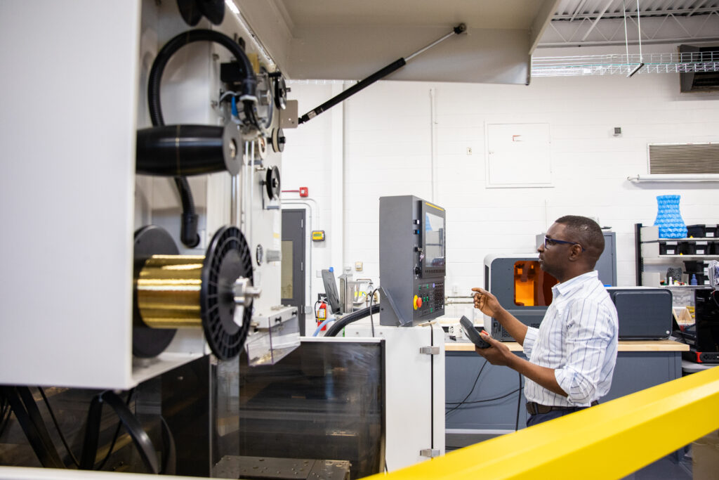 a person operating manufacturing technology