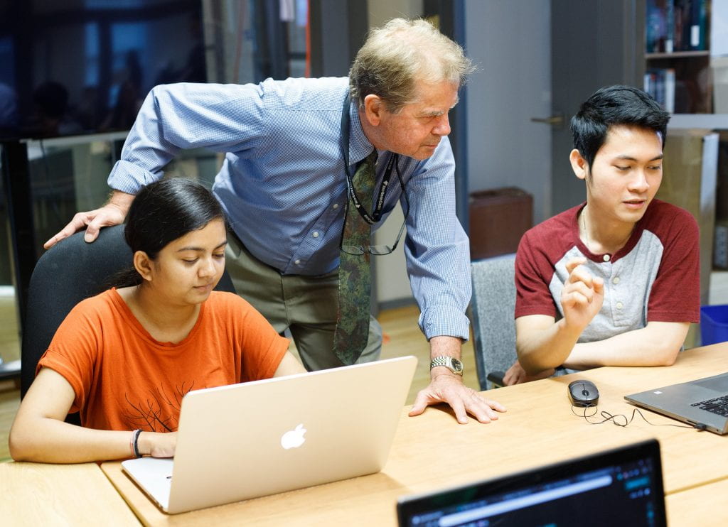 Instructor helping students