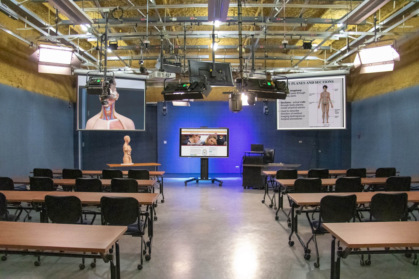 The Connected Classroom is equipped with studio lighting and cameras, two project screens, and has seating for 60.