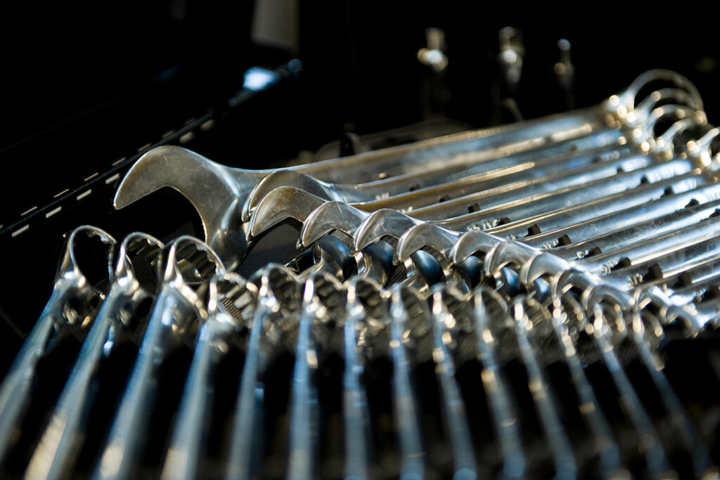 Close up photo of many wrenches laid out in a toolbox
