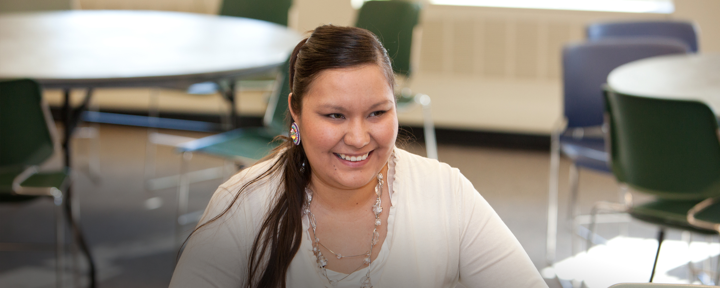 Smiling woman in classroom