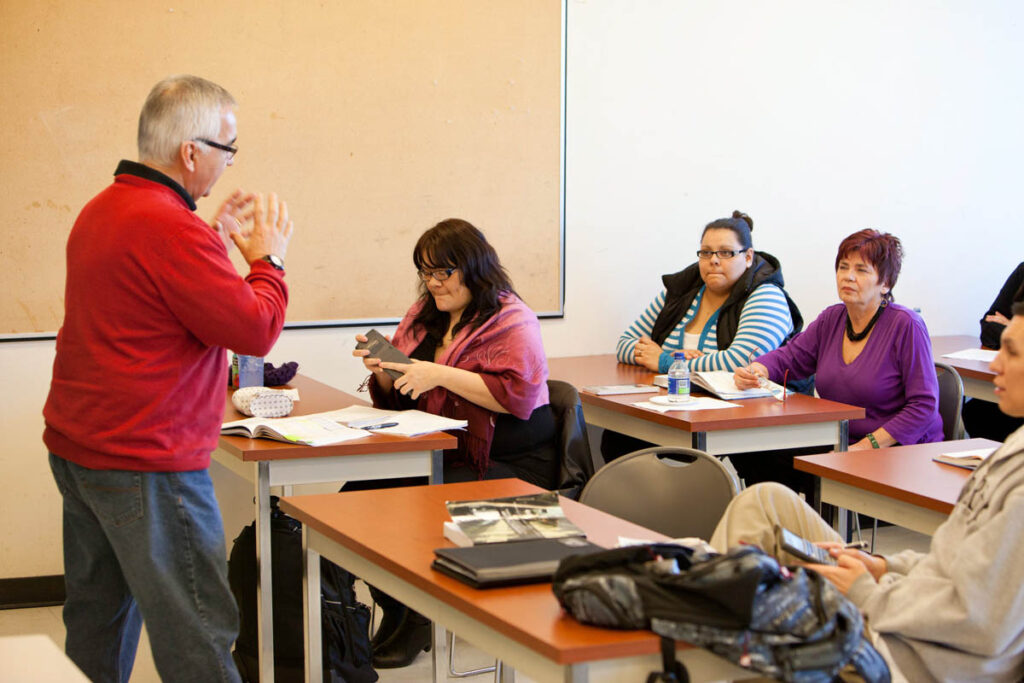 Instructor talking to classroom full of students