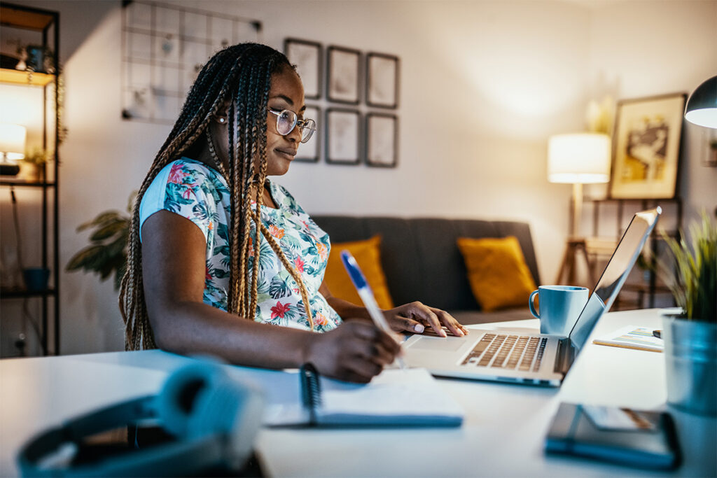 Woman using a laptop in her living room