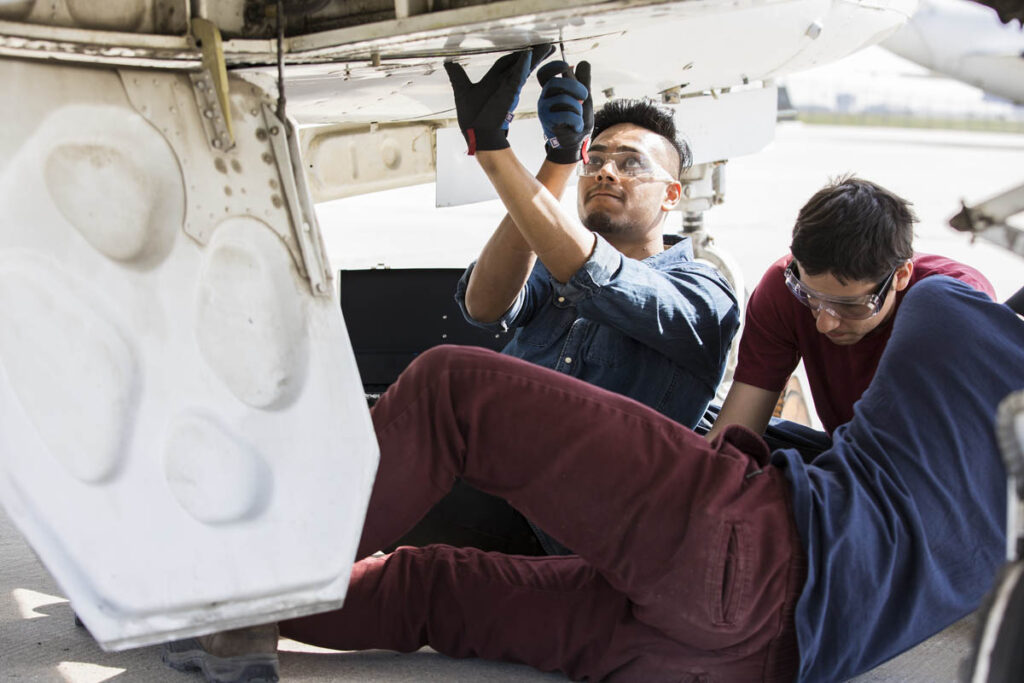 Students working on aircraft