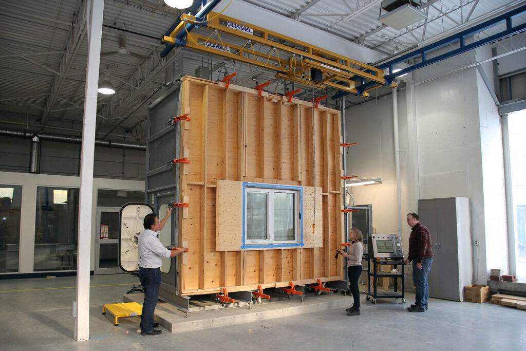 Wall with window being built in a lab for testing