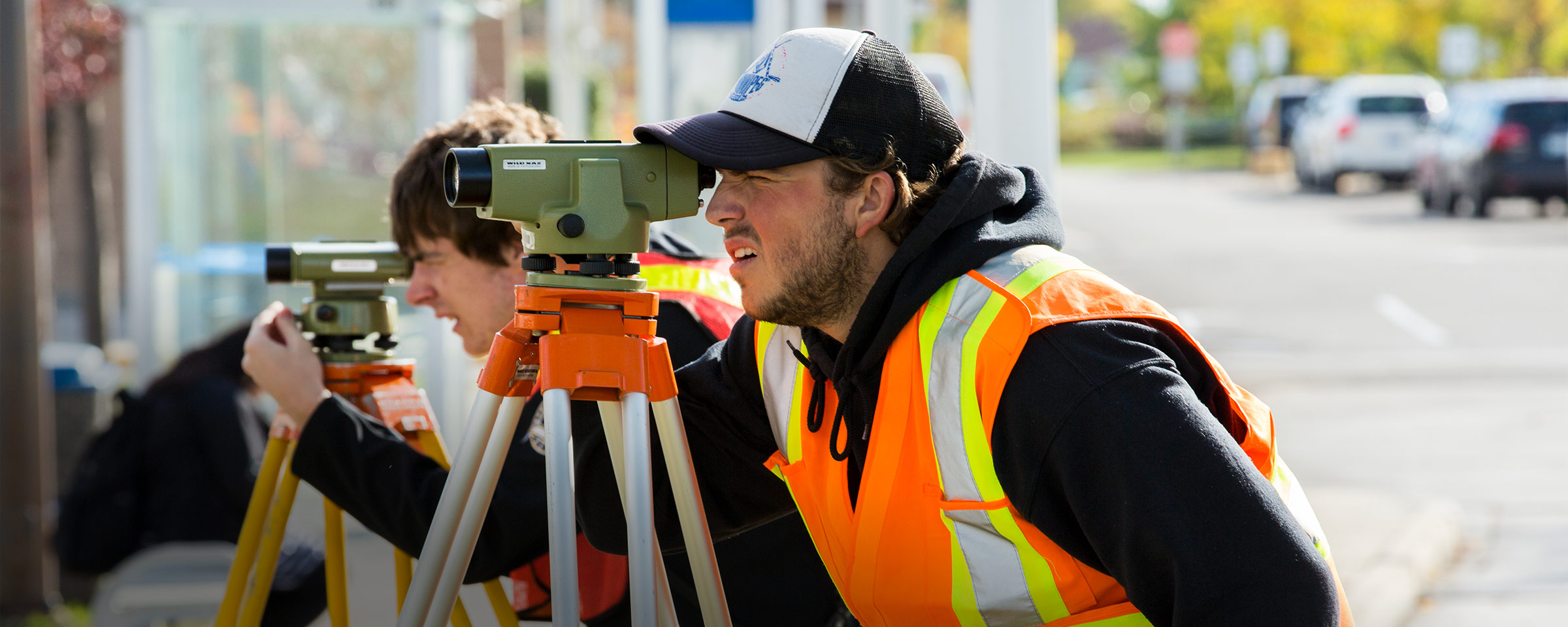Civil technician student surveying outdoors