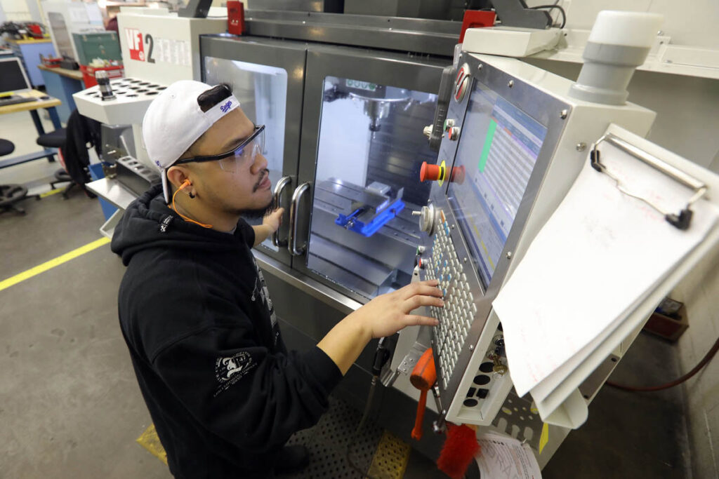 Student working on CNC machine