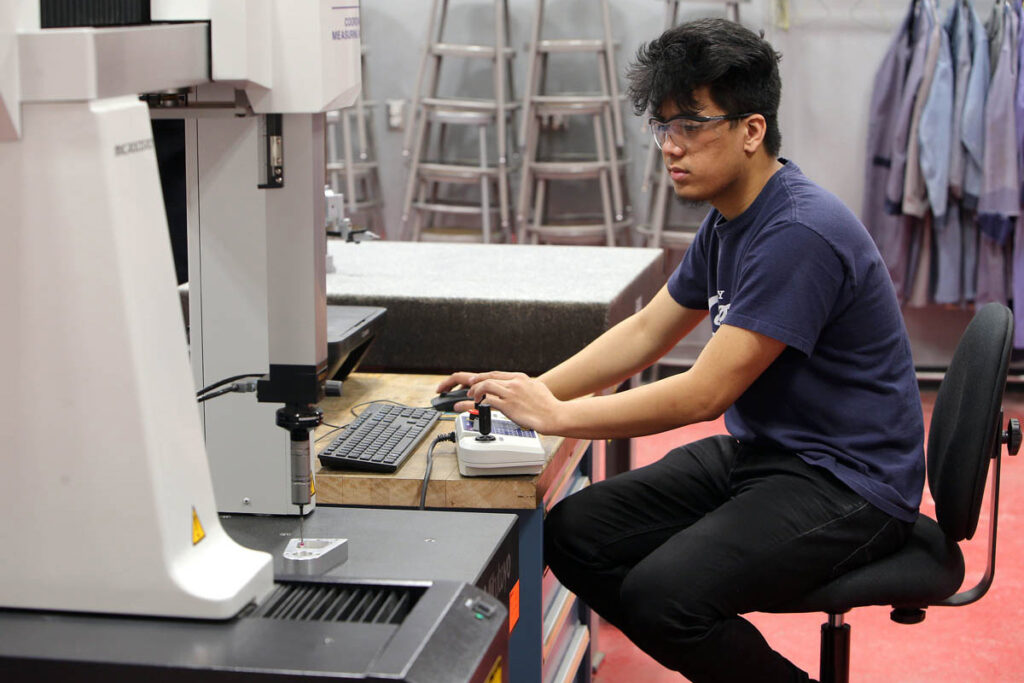 Student working on CNC machine