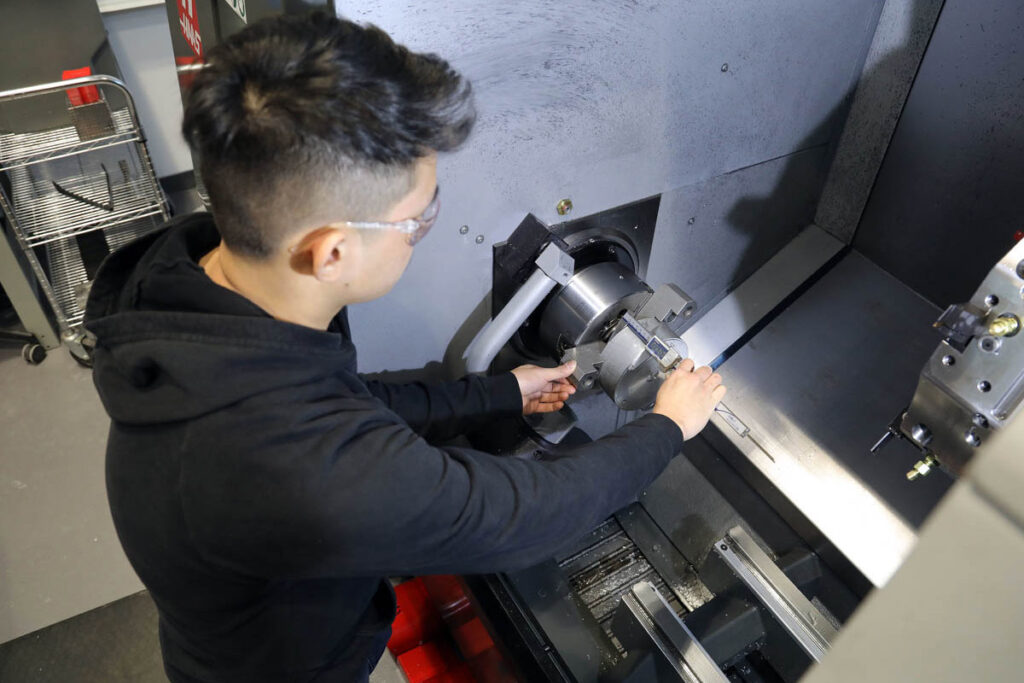 Student working on CNC machine