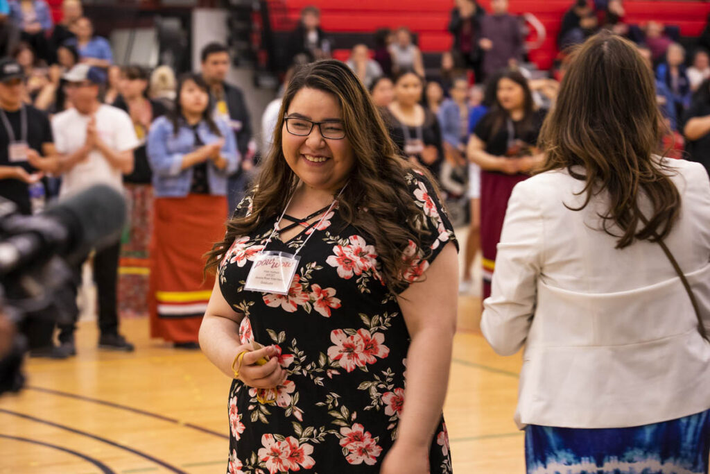 Smiling woman at Indigenous Graduation Pow Wow