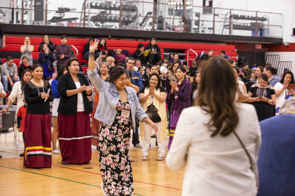 Smiling woman at Indigenous Graduation Pow Wow