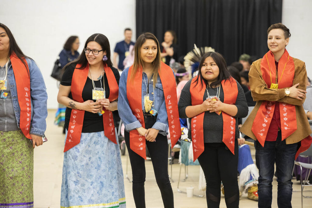 Group of students wearing Stoles at the Indigenous Graduation Pow Wow