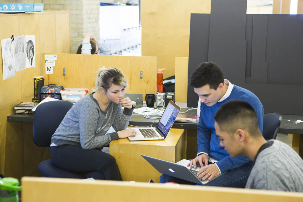 Students critiquing each others work in the design studio