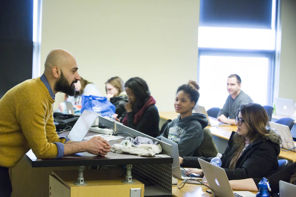 Instructor talking to classroom of students