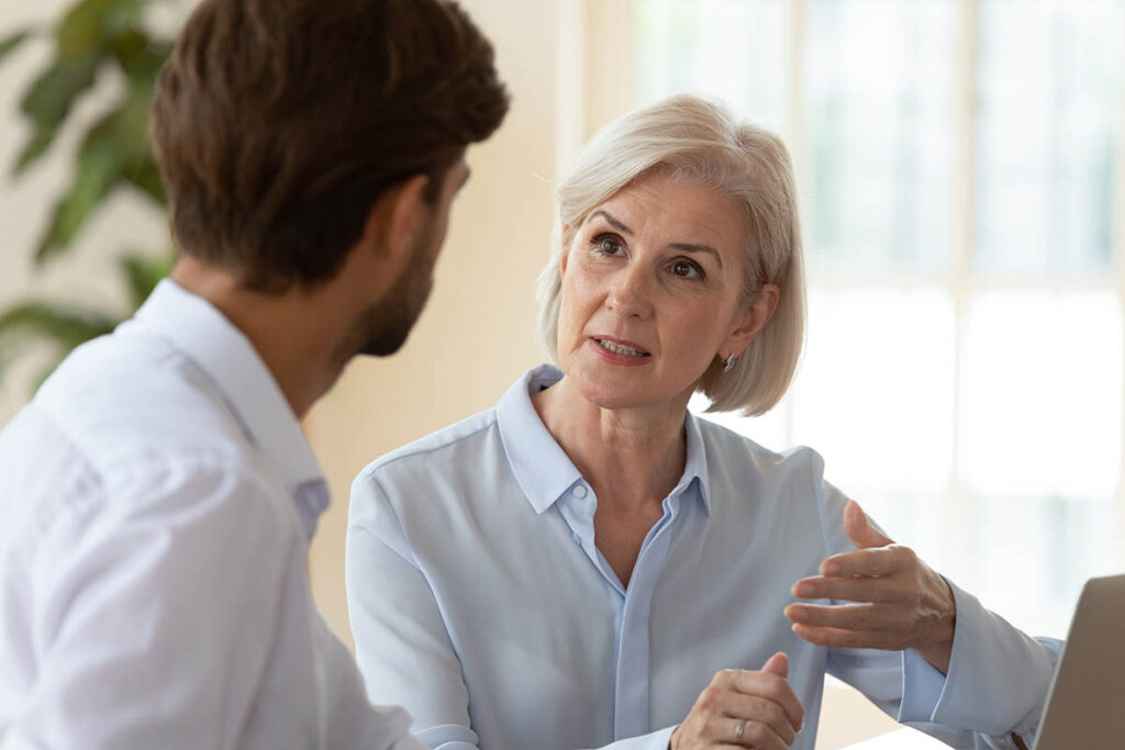 Woman talking to man in an office