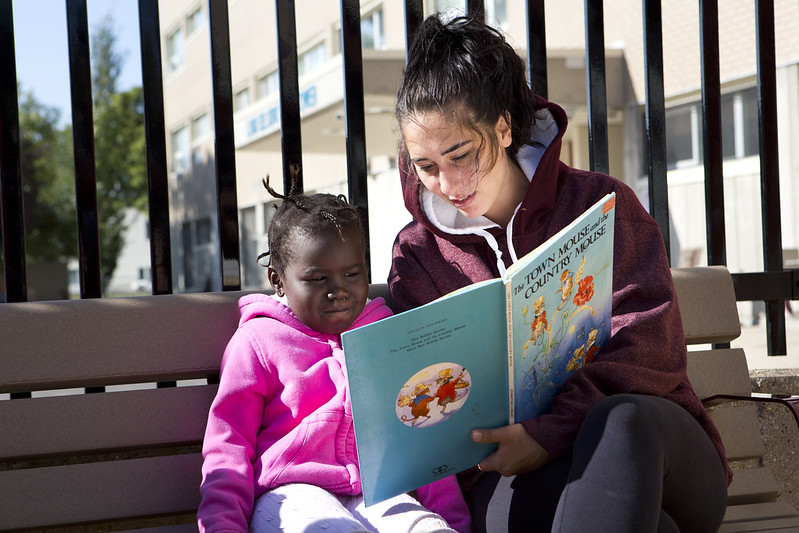 Woman reading to child