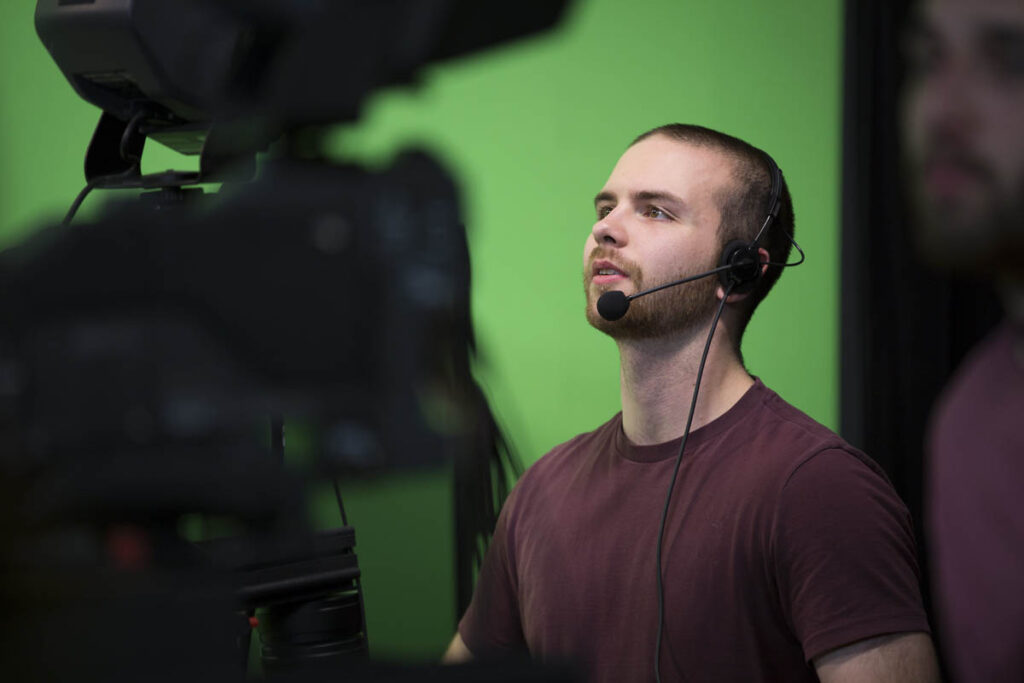 Man operating a TV camera