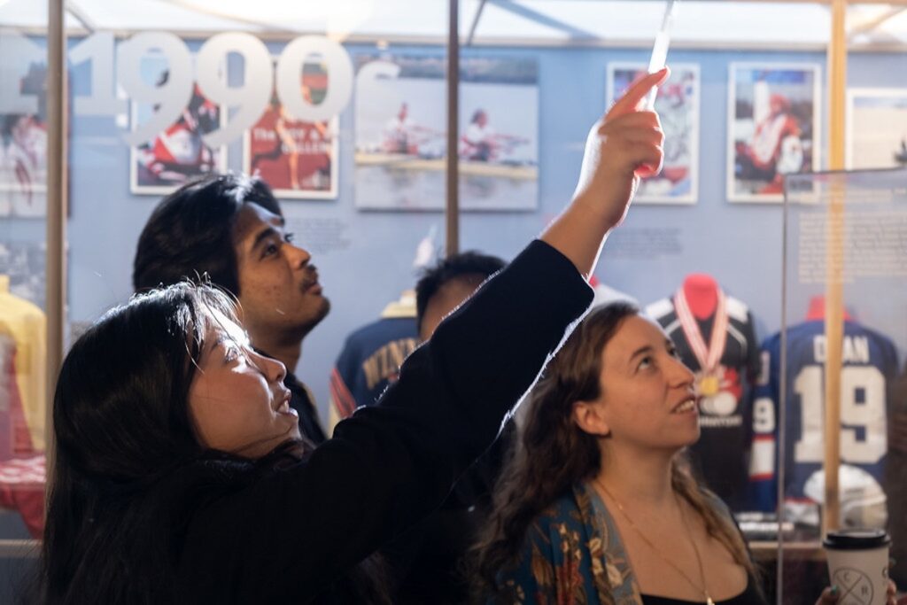 Group of students in a museum looking at something above