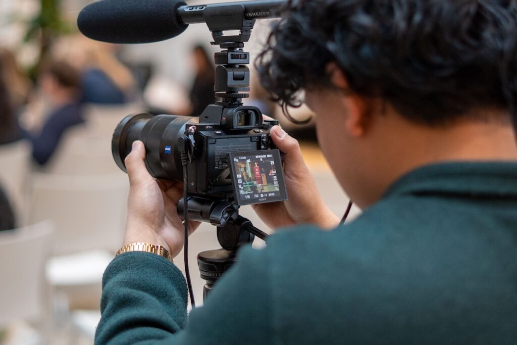 Person looking at a screen on a back of a camera