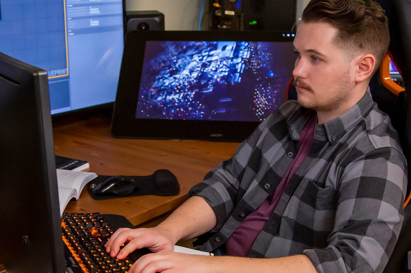 Guy typing on keyboard