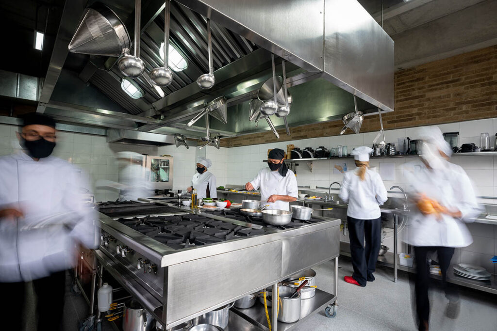 Photo of many culinary students in a kitchen