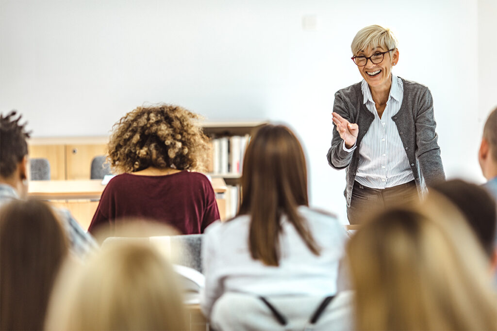 Instructor talking to a classroom full of people