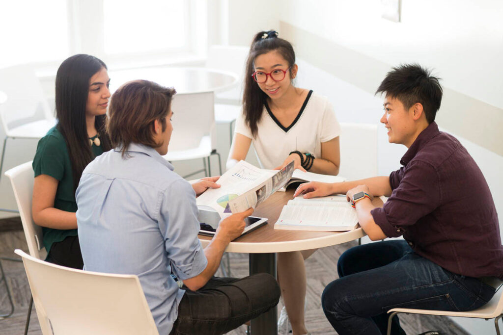 Group of students sitting around a table