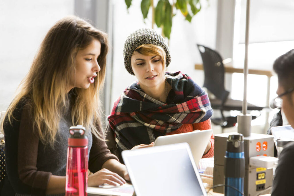 Two girls looking at a laptop