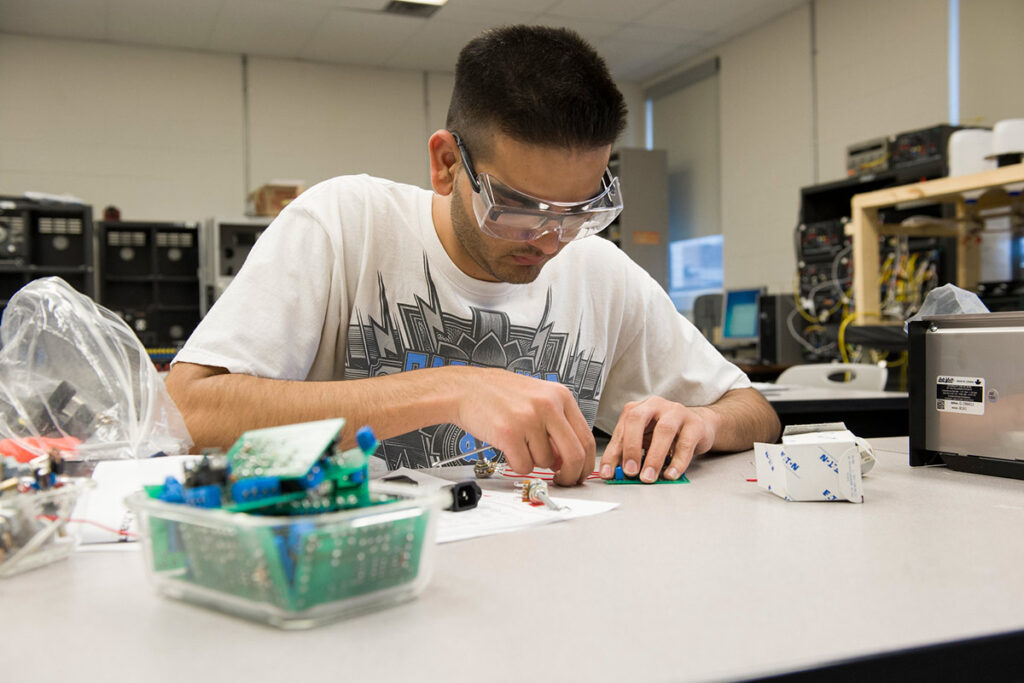 Student working in an electronic engineering lab