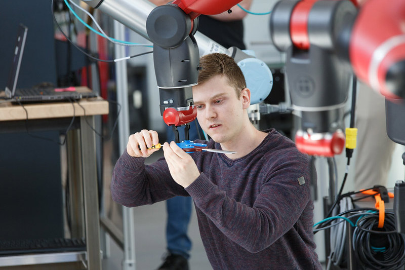 Student working with robotics equipment