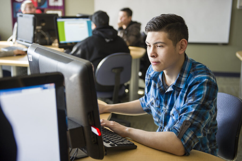 Student working on a computer in a computer lab