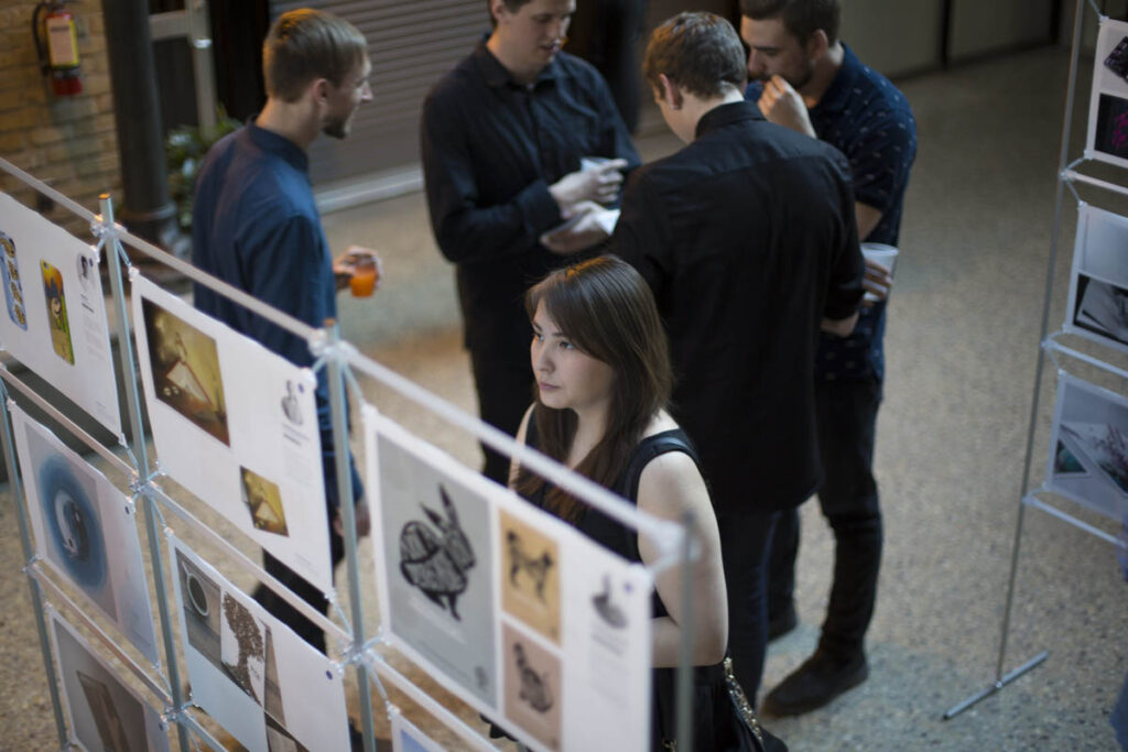 People mingling at a large art show