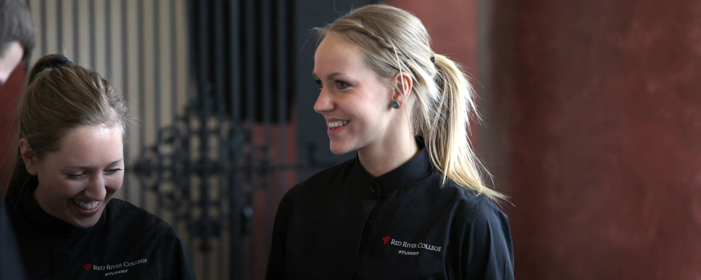 Smiling hostess in a restaurant