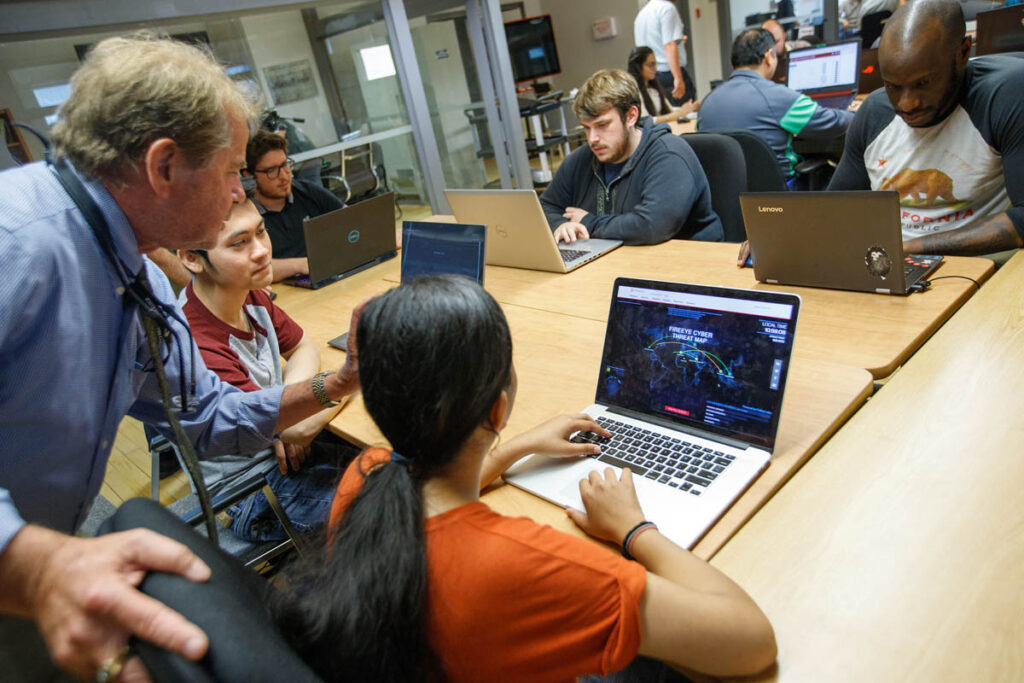 Instructor talking to students in a classroom