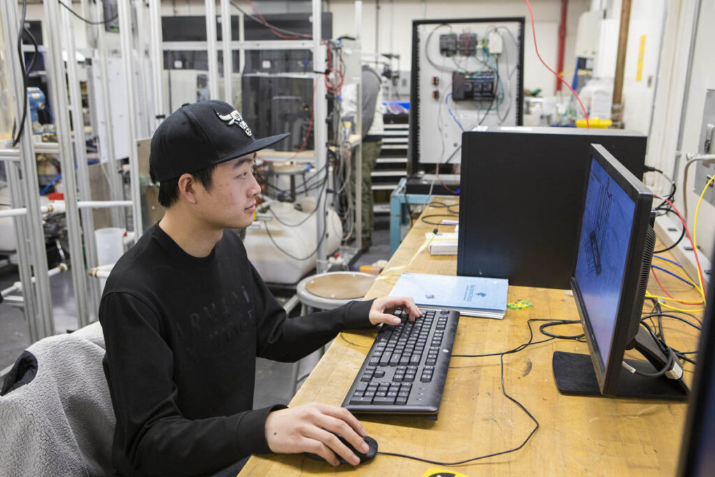 Student in a computer lab working on a computer