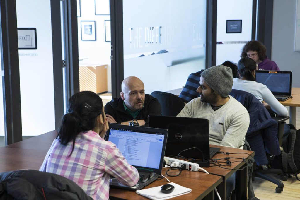 Students in a classroom working on laptops