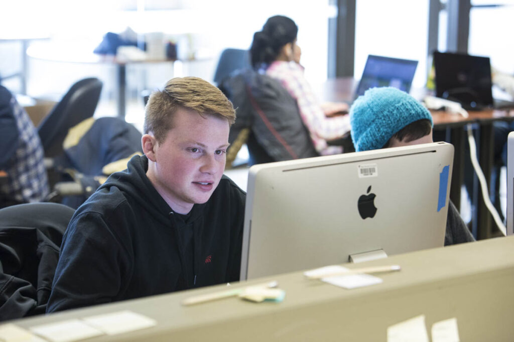 Student working on a computer in a computer lab