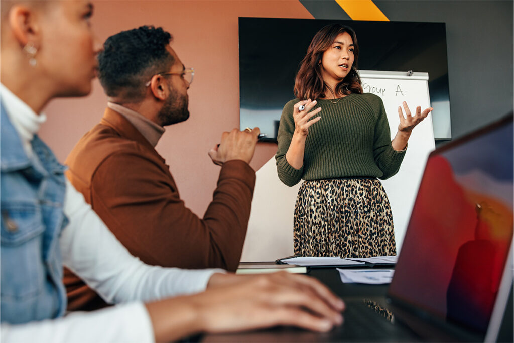 Woman giving a presentation in a boardroom