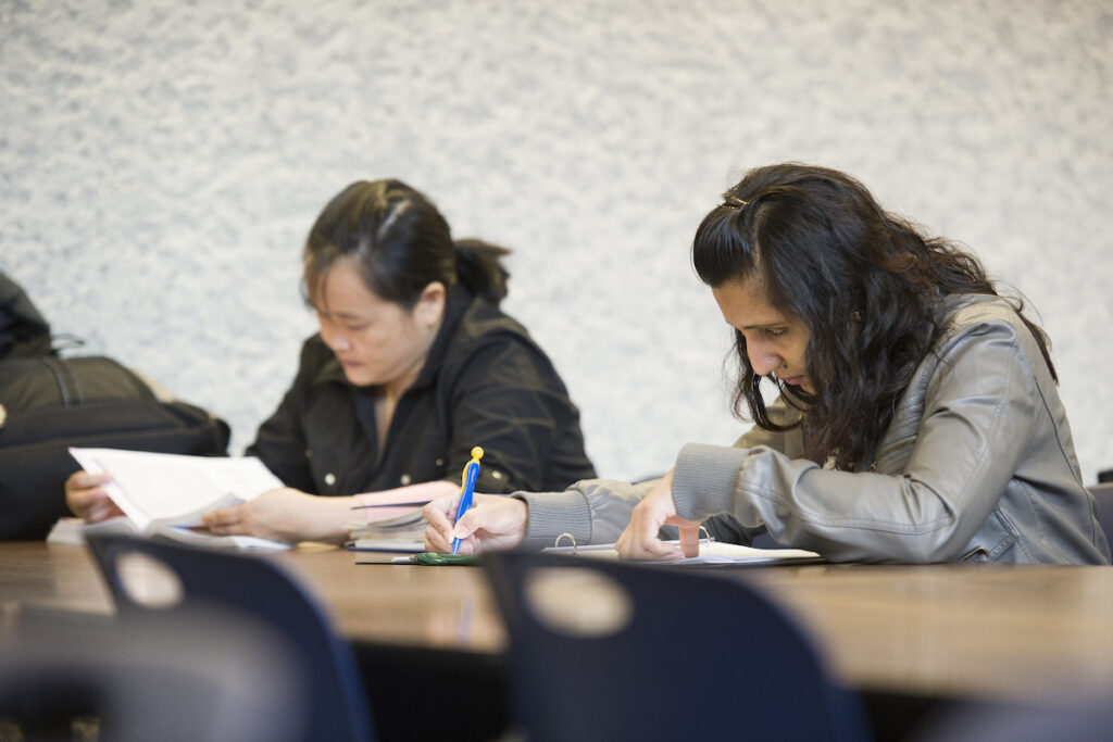 Students taking notes in a classroom