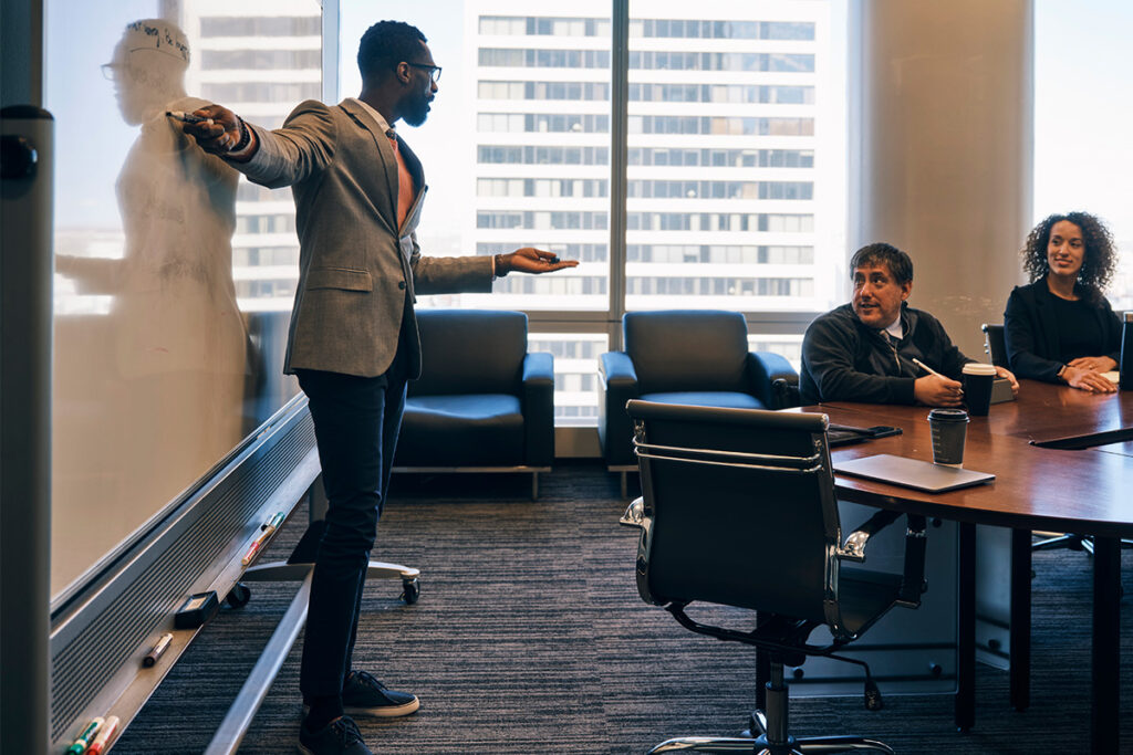 Businessman giving a presentation in a boardroom