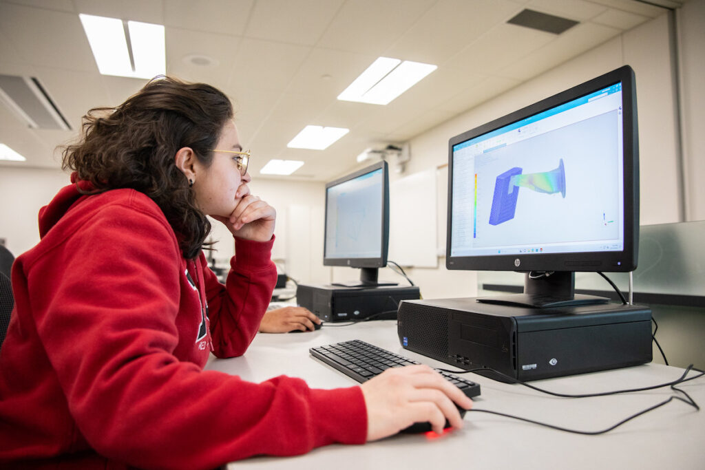 Student using a 3D computer aided drafting software in a computer lab.