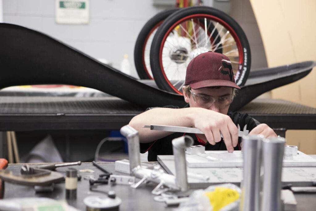 Mechanical engineering technology student working in a lab